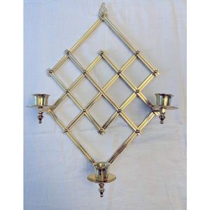 Contemporary accordion style wall sconce. Holds three candles